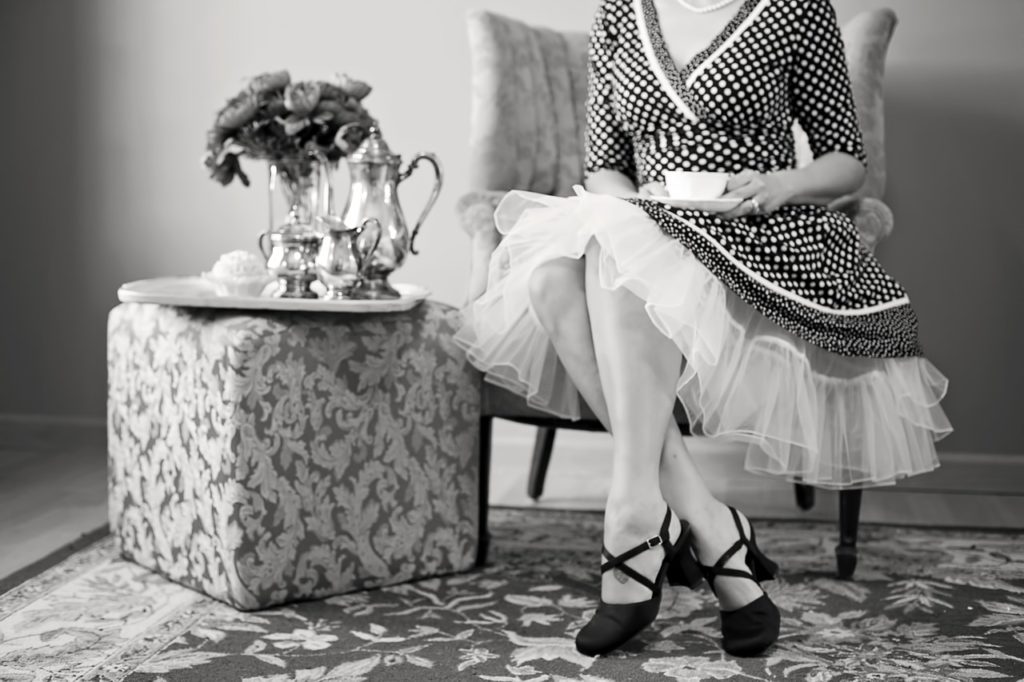 Lady seated with cup of tea_tea party